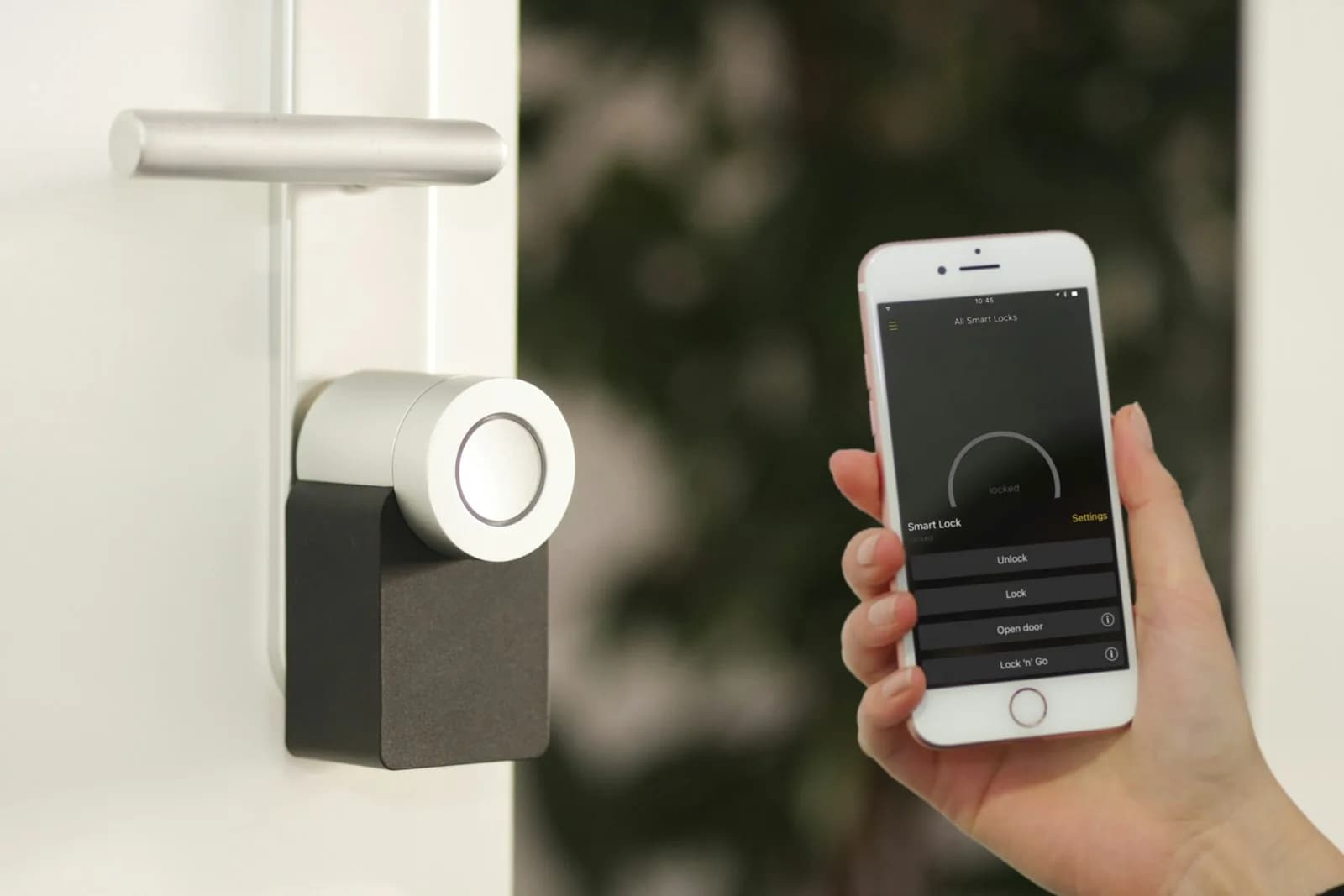 Wall-mounted smart home control panel in a modern hallway